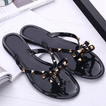 Chic Signature | Gold Studded Jelly Thong Sandal with Bow Detail | Stylish Footwear for Year-Round Elegance
