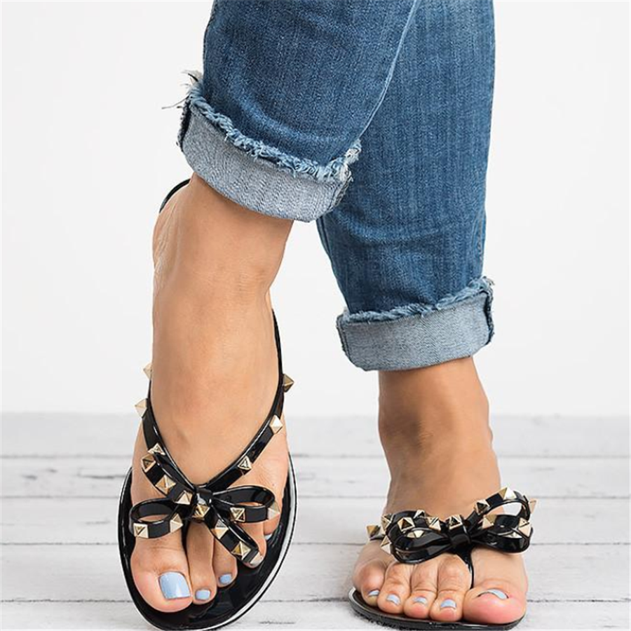Chic Signature | Gold Studded Jelly Thong Sandal with Bow Detail | Stylish Footwear for Year-Round Elegance