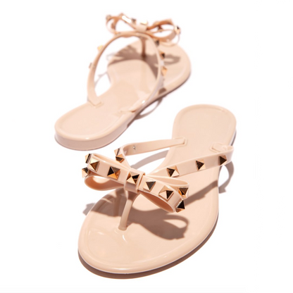 Chic Signature | Gold Studded Jelly Thong Sandal with Bow Detail | Stylish Footwear for Year-Round Elegance