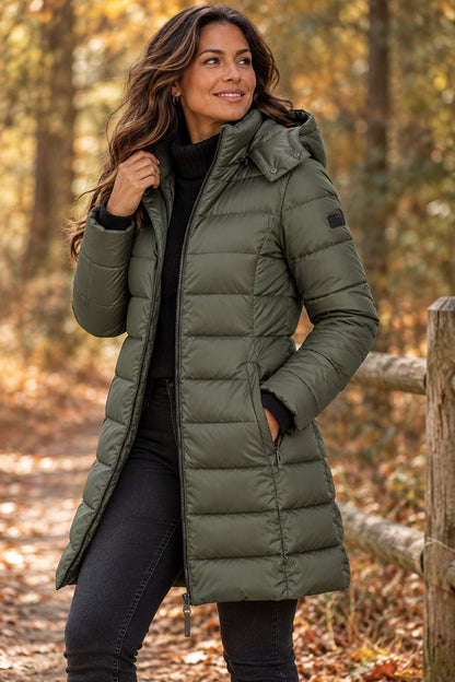 Olive green long hooded puffer coat outdoors
